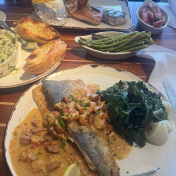 Pappas Seafood House - Salmon, shrimp, scallops, and crab cake with a loaded baked potato, carrots and asparagus. - Seafood Near Me - Webster, Texas
