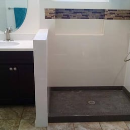 This is the bathroom before the shower walls were installed. I love the glass tiles.