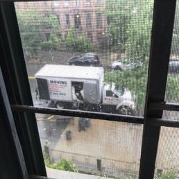 MAC Moving team working through the rain.
