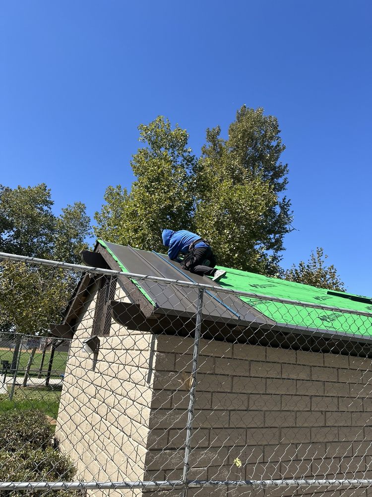 Slide of T’s Roofing 