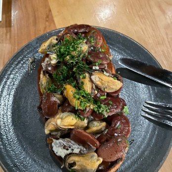 Squable - mussels on grilled bread - Modern European Near Me - Houston, Texas Squable - mussels on grilled bread - Modern European Near Me - Houston, Texas
