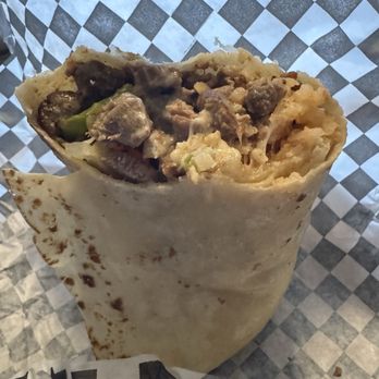 Los Bros Taco Shop - Steak fajita burrito. Huge and stuffed full of meat! I had eaten about half when I remembered to take a picture. - Mexican Near Me - Vancouver, Washington