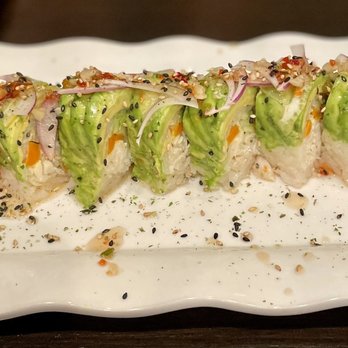 Sushi Station - a sushi roll on a white plate - Japanese Near Me - Riverside, California Sushi Station - a sushi roll on a white plate - Japanese Near Me - Riverside, California