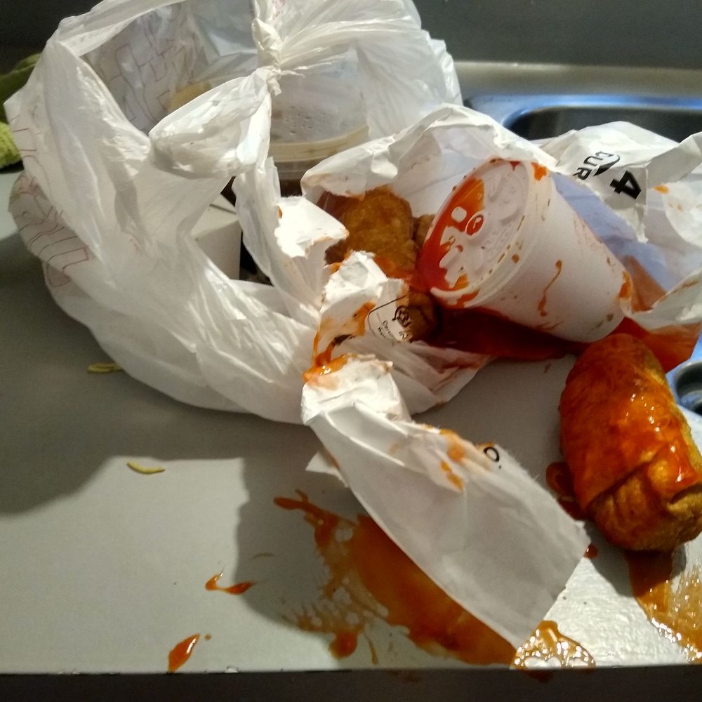 a hot dog wrapped in paper a hot dog wrapped in paper