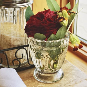 The Braeburn - Fresh ranunculus, table by the front window. - Breakfast & Brunch Near Me - Langley, Washington