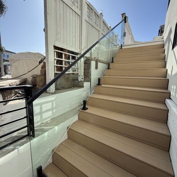 Pristine Glass Works - Custom glass railing with matte black hardware. Surface mount brackets. - Glass & Mirrors Near Me Pristine Glass Works - Custom glass railing with matte black hardware. Surface mount brackets. - Glass & Mirrors Near Me