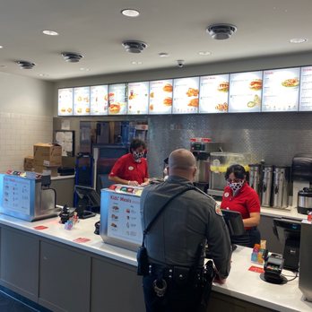 Chick-fil-A - ows a man standing at a counter in a fast food restaurant - Fast Food Near Me - Santa Fe, New Mexico