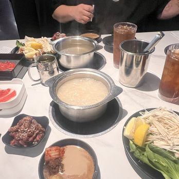 Boiling World - Pho broth in tip, Tonkatsu broth on bottom. - Hot Pot Near Me - Ontario, California