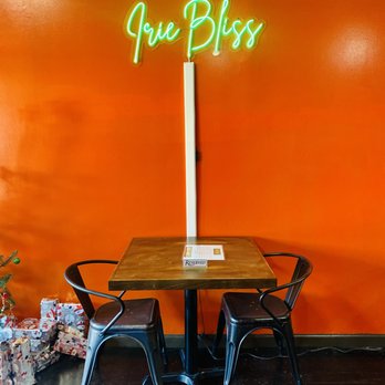 Irie Bliss Nyc - a neon sign on a wall - Soul Food Near Me - New York, New York Irie Bliss Nyc - a neon sign on a wall - Soul Food Near Me - New York, New York