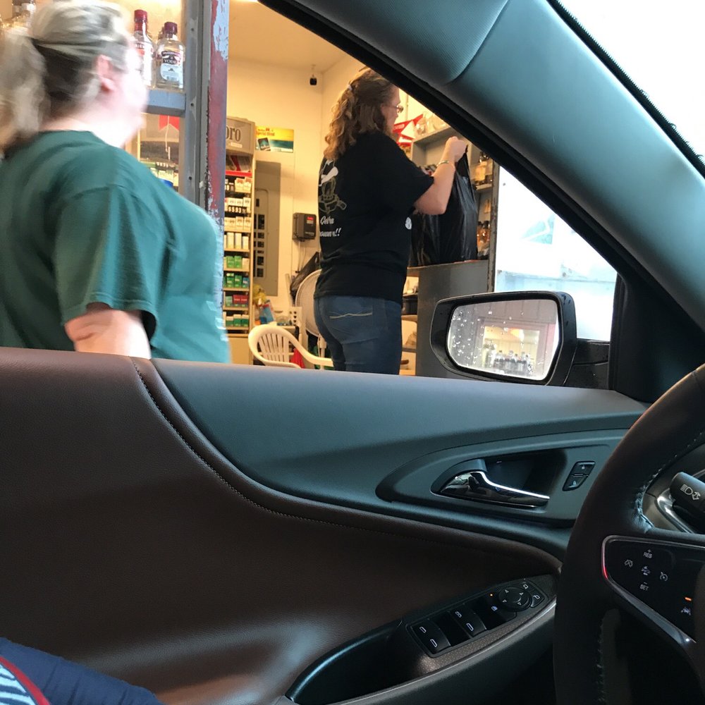 Joe's Beverage Barn - a woman sitting in the driver's seat of a car - Beer, Wine & Spirits Near Me - Winnie, Texas Joe's Beverage Barn - a woman sitting in the driver's seat of a car - Beer, Wine & Spirits Near Me - Winnie, Texas