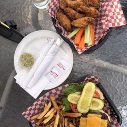 The Bobcaygeon Inn - His and hers: one order of their wings and the classic burger and fries! Both were delicious! :D