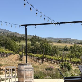 Long Walk Vineyard - outside patio with view of some of the vineyard, sun and shade places to sit. - Wine Tasting Room Near Me - Ashland, Oregon Long Walk Vineyard - outside patio with view of some of the vineyard, sun and shade places to sit. - Wine Tasting Room Near Me - Ashland, Oregon