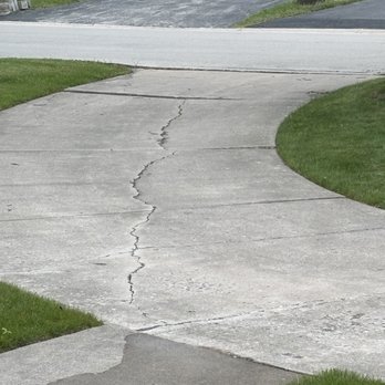 Lalos General Construction - before- large crack and uneven driveway - Masonry/Concrete Near Me - Lombard, Illinois