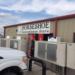 Horseshoe Convenience Store - The banner on the front side of the store to the left of the entrance.