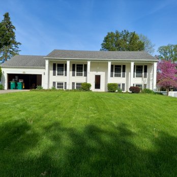 Flipping Rochester - We painted the columns and garage - Painters Near Me