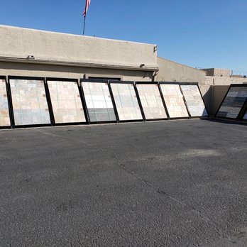 North Valley Stone Supply - Outside of the building has several different displays of travertine pavers, limestone and stacked stone! Wide variety selection - Building Supplies Near Me - Phoenix, Arizona