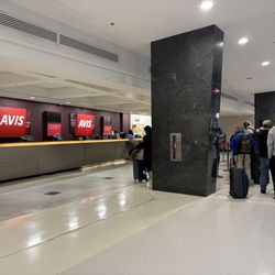 Avis - Only 2 employees trying to process everyone. Over an hour of waiting...