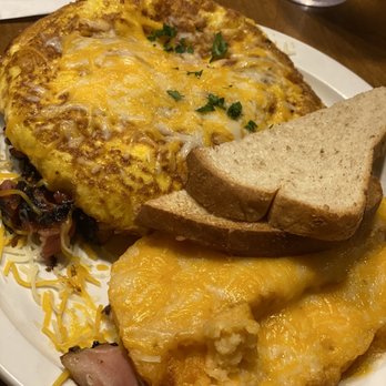 Mud Street Cafe - Ham and cheese "omelette" with cold grits and cold barely toasted toast - Cafes Near Me - Eureka Springs, Arkansas Mud Street Cafe - Ham and cheese "omelette" with cold grits and cold barely toasted toast - Cafes Near Me - Eureka Springs, Arkansas
