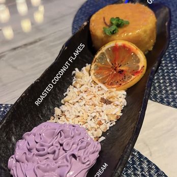 RumFire Poipu Beach - Olive oil cake with roasted coconut flakes and ube whipped cream - Seafood Near Me - Koloa, Hawaii RumFire Poipu Beach - Olive oil cake with roasted coconut flakes and ube whipped cream - Seafood Near Me - Koloa, Hawaii