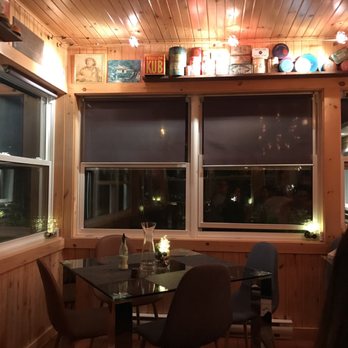 Le Saint Honore - a dining room with a table and chairs - French Near Me - Carleton-sur-Mer, Quebec