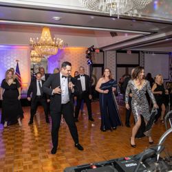 Fred Astaire Dance Studios - Owners Kris & Briana Suakjian leading a salsa line dance at the Laguna Hills Chamber of Commerce Gala banquet event.