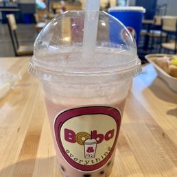 Strawberry milk tea on ice (subbed standard whole milk for almond milk) with regular/original boba