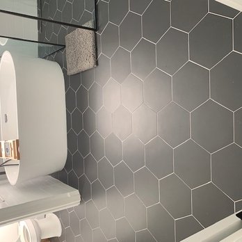 Dimension Flooring Services - a bathroom with hexagon tiles - Flooring Near Me Dimension Flooring Services - a bathroom with hexagon tiles - Flooring Near Me