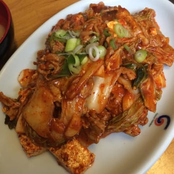 Four Seasons - Jaeyook Kimchi: "Kimchi sauteed with sliced porks, rice cakes, and scallions in a spicy sauce served with tofu on side" - Korean Near Me - Ithaca, New York