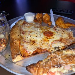JC Wing Company / Famous Original Louie's New York Pizzeria - Giant pepperoni slice with bone in wings