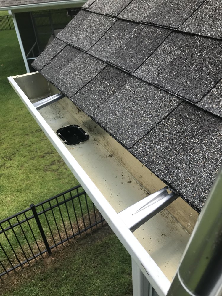 Slide of Gutter Clutter Cleaning & Roof Repair