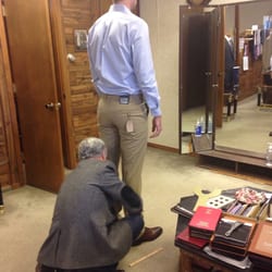 John measuring my fiancé's khakis to be hemmed