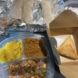 Injera and vege platter and samosa w/ lentils so delicious definitely returning back here