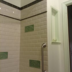Cowperthwaite Hininger General Contractors - Shower/bath showing how an ugly tiny cabinet turned into a clean classy niche.