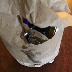 South Street Liquor Store - One of the bottles spilled out in the ripped bag as well. This is why we can't have nice things