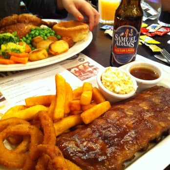 The White Swan - Full Rack Baby Back Ribs, Onion Rings, Chips, Slaw, Extra BBQ Sauce + US Craft Beer £7.99! - Pubs Near Me - London, XGL The White Swan - Full Rack Baby Back Ribs, Onion Rings, Chips, Slaw, Extra BBQ Sauce + US Craft Beer £7.99! - Pubs Near Me - London, XGL
