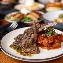 Lamb lollipops with chipotle patatas bravas