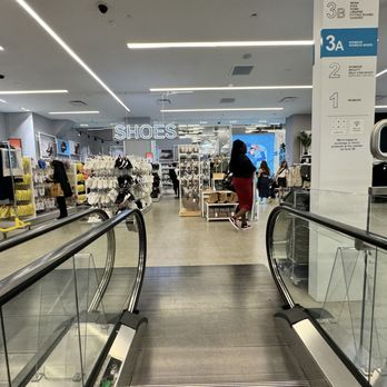 Primark - A Primark store interior in Brooklyn, NY, with clothing racks, shoe displays, and signage indicating different sections. - Women's Clothing Near Me - Brooklyn, New York