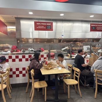 Five Guys - Waiting for order. About 10 tables inside - Burgers Near Me - Alameda, California