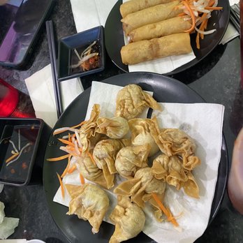 Pho Uncle Ten - two plates of food on a table - Vietnamese Near Me - Calgary, Alberta Pho Uncle Ten - two plates of food on a table - Vietnamese Near Me - Calgary, Alberta