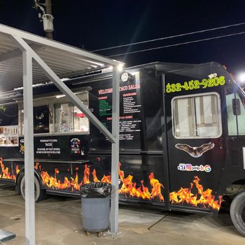 Taco Salsa - a black food truck with flames on the side - Food Trucks Near Me - Houston, Texas