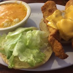 Catfish sandwich and buttered grits with cheese Catfish sandwich and buttered grits with cheese