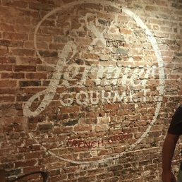 Logo on exposed brick wall. Interior. Logo on exposed brick wall. Interior.