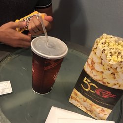 Metro Caribbean Cinemas - Food is very inexpensive, we got a large coke, Extra popcorn and m&ms for around $7.