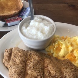 Catfish and Eggs with grits and toast. Catfish and Eggs with grits and toast.