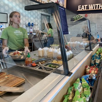 Just Salad - a woman preparing food in a restaurant - Salad Near Me - Pompton Plains, New Jersey Just Salad - a woman preparing food in a restaurant - Salad Near Me - Pompton Plains, New Jersey