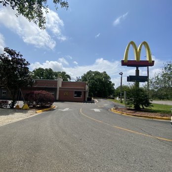 McDonald's - a person's thumb in front of a mcdonald's - Burgers Near Me - Irvington, Alabama