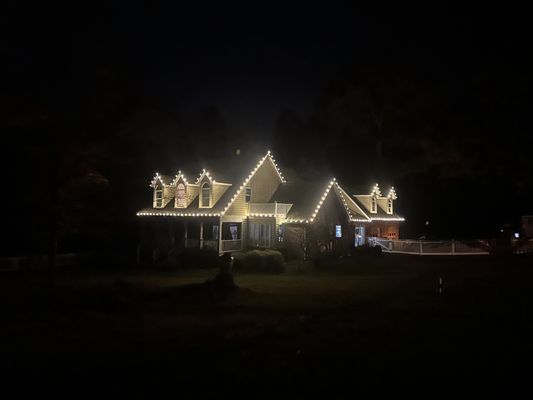 Warm White C9 Roofline Holiday Lighting Installation - This holiday lighting project features custom-cut warm white C9 bulbs installed along the full roofline of this beautiful home. Every strand was built on-site for perfect spacing and clean, straight lines.

Our team at R&E Home Services handled the full process — design, installation, maintenance, takedown, and storage. We use commercial-grade materials to ensure the lights stay tight, bright, and weather-resistant throughout the entire season.

This installation is part of our full-service holiday lighting program, designed to give homeowners a premium, hands-free experience from start to finish.