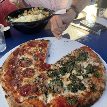 One Barrel Brewing - Pizza with different toppings on the two sides. Caesar for sharing... - Breweries Near Me - Egg Harbor, Wisconsin