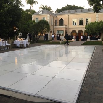 White Dance Floor Over Swimming Pool For A Wedding In Beverly