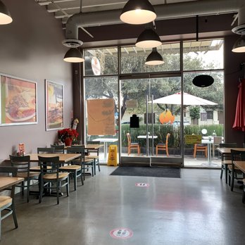 Mediterranean Grill - tables and chairs in a restaurant - Mediterranean Near Me - Pasadena, California Mediterranean Grill - tables and chairs in a restaurant - Mediterranean Near Me - Pasadena, California